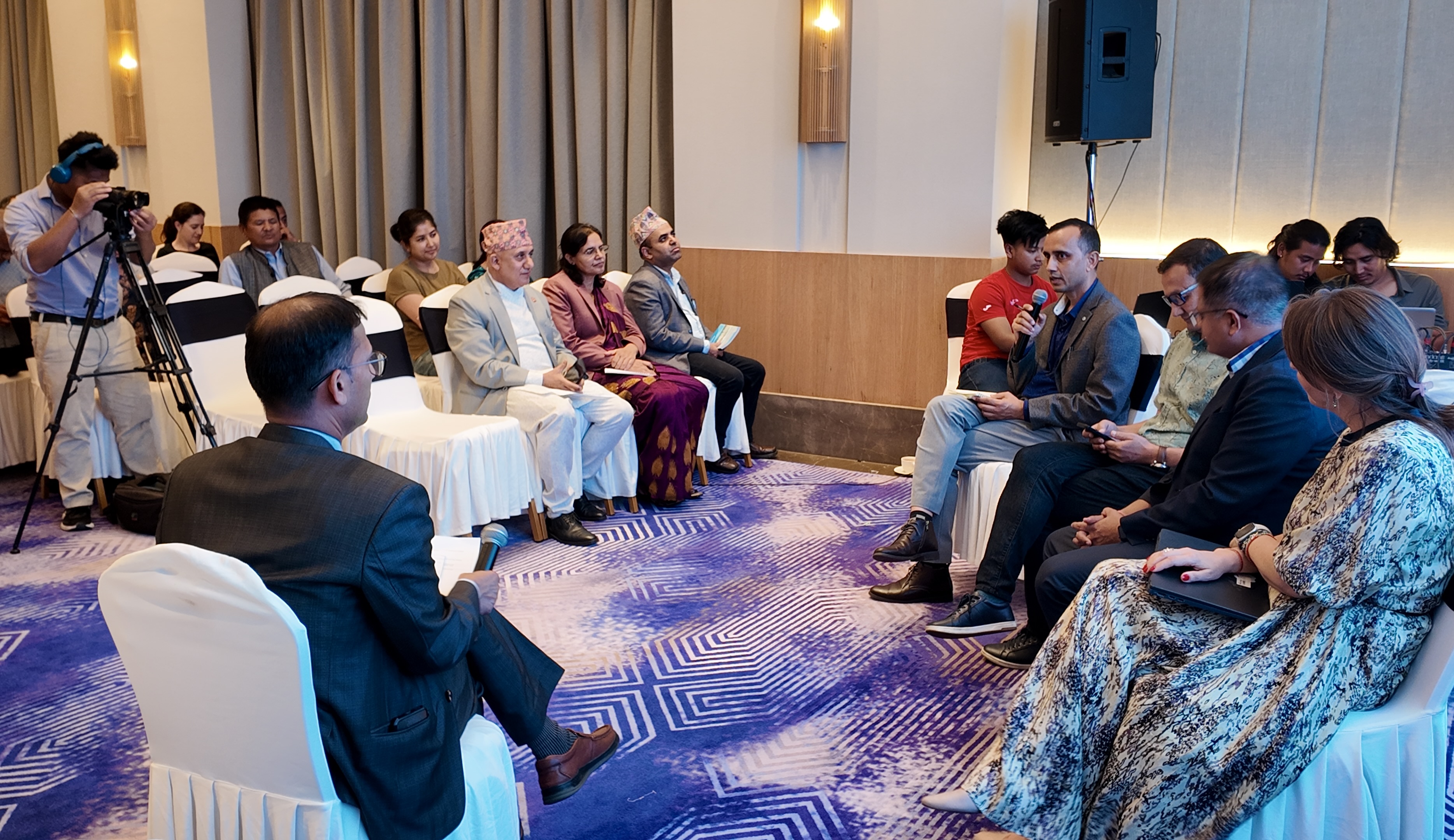 BCEPS Senior Researcher Krishna Aryal speaking on a panel at the launch event