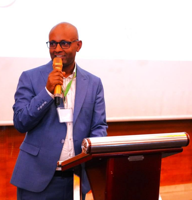 Man talking into a microphone. 