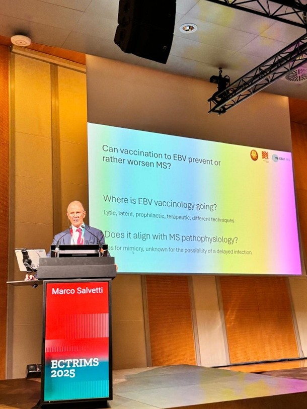 A professor presenting at a conference