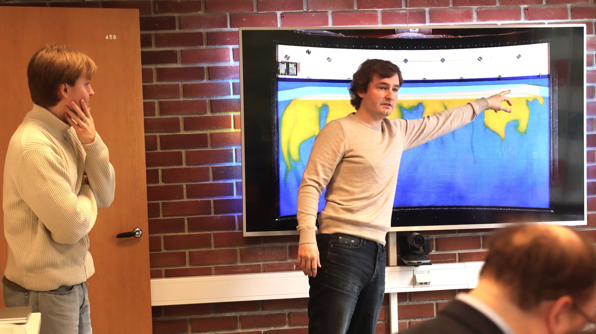 Master's students presenting their research connected to the FluidFlower