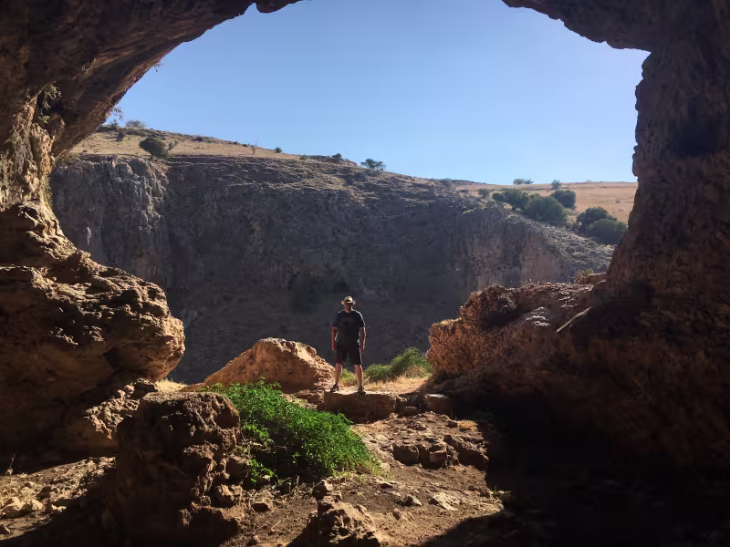 Jeremy at the entrance of an archaeological cave site