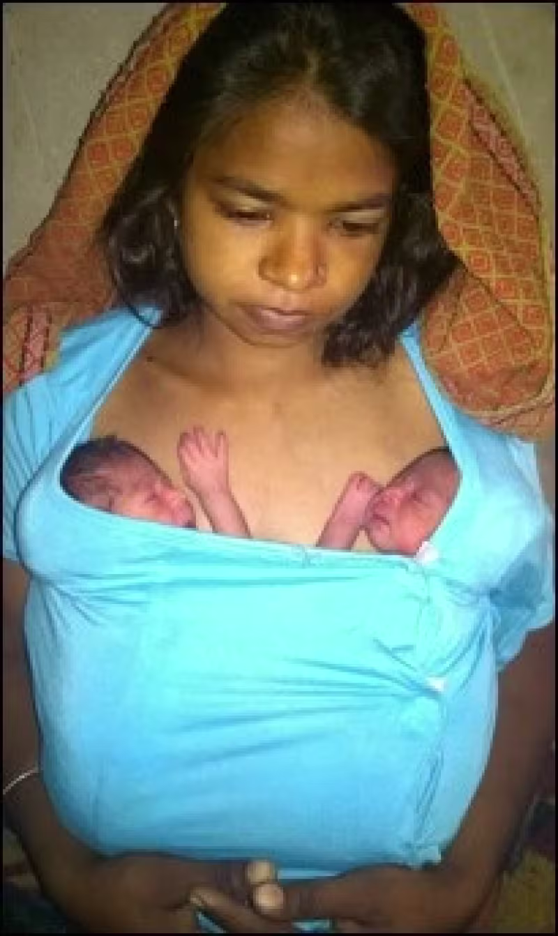 Mother doing KMC with Twins