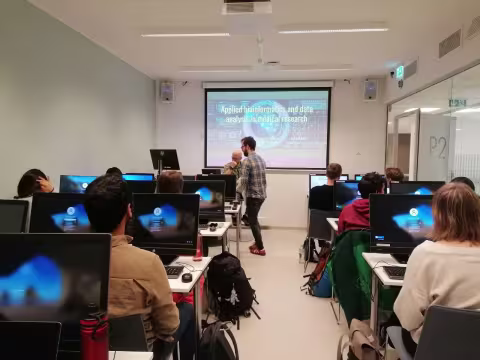 Photo from a data room with the students in front of each their screen.