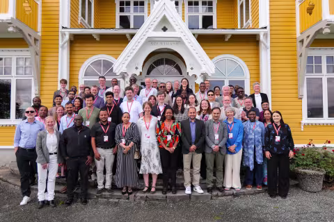 Group photo of conference participants from 2025. 