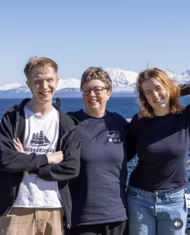 three researchers on a ship in northern Norway