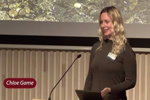 Chloe speaking at annual meeting 2024