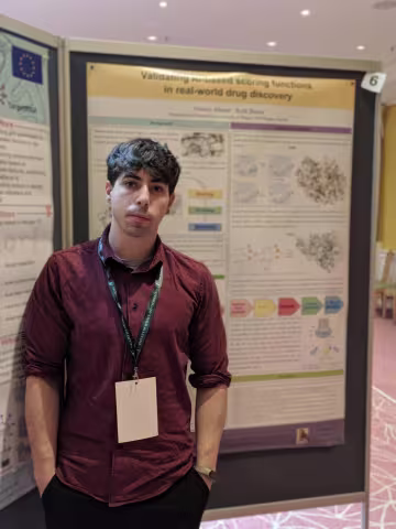 Alberto Meme presenting his poster.