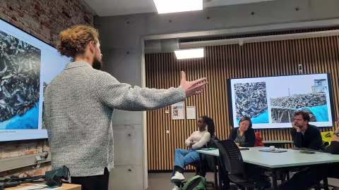 People presenting at the fish feed workshop