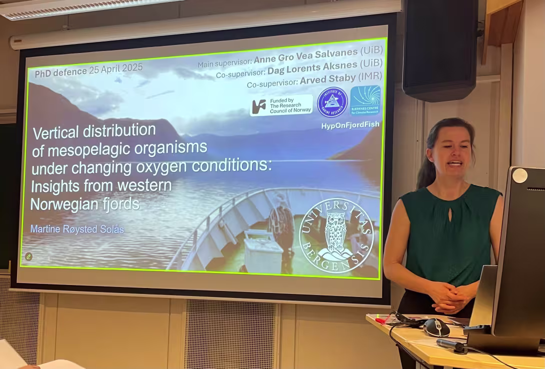 Martine and the power point showing the title of her PhD thesis