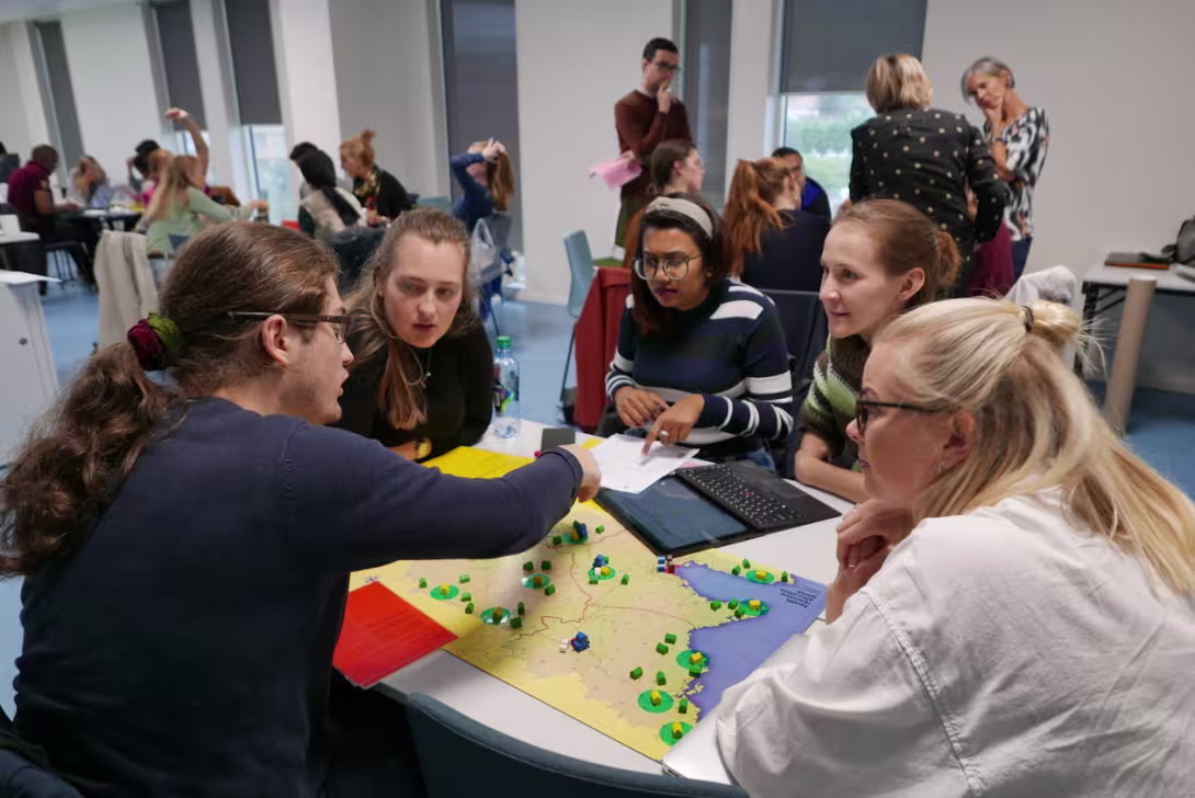 Photo of students playing Health systems board game
